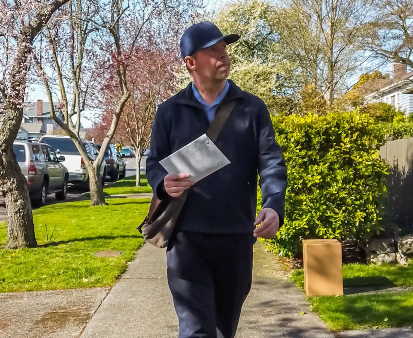 a mailman delivering letters